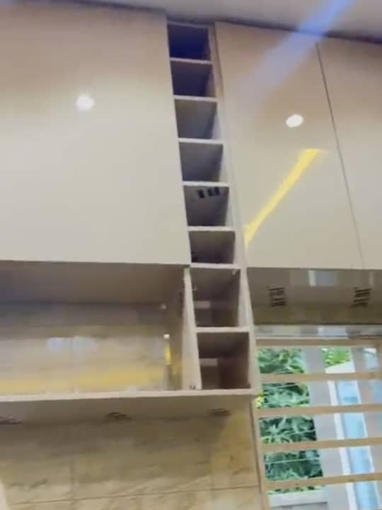 Base and wall carcasses set in place, open shelving compartments visible before the doors go on