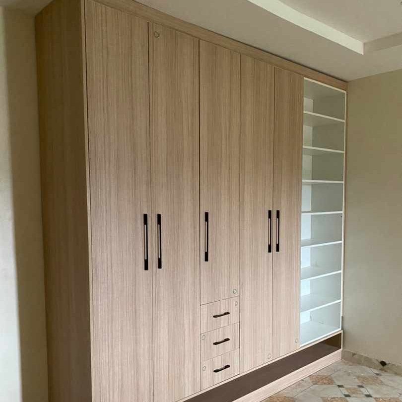 Light oak wardrobe doors, showing the grain match across the run
